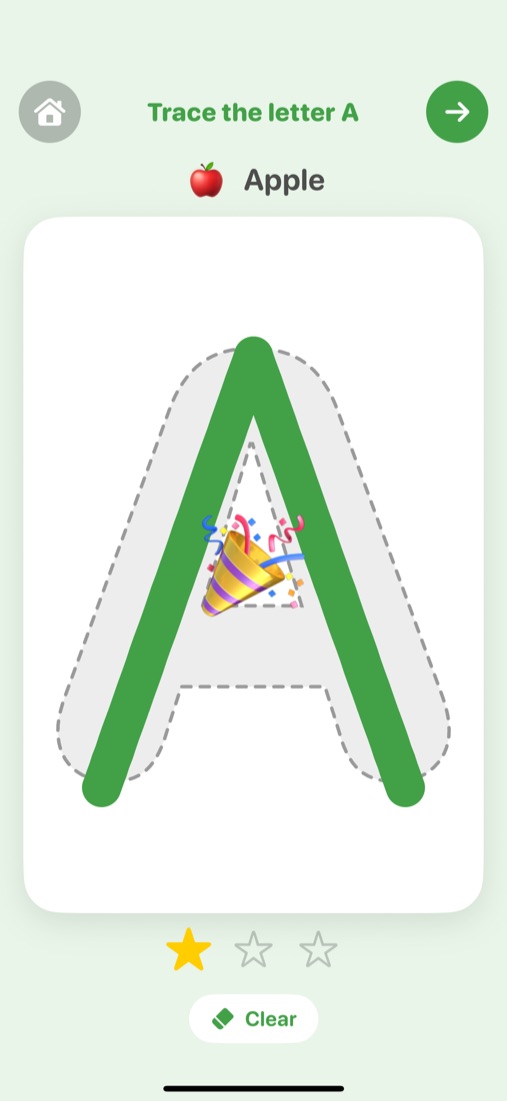 Tracing the letter A with a green line and a star earned